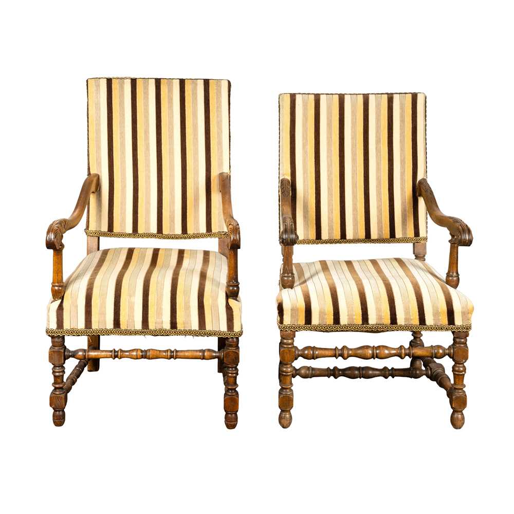 Lot 6 - A near pair of Louis XIII style walnut open armchairs