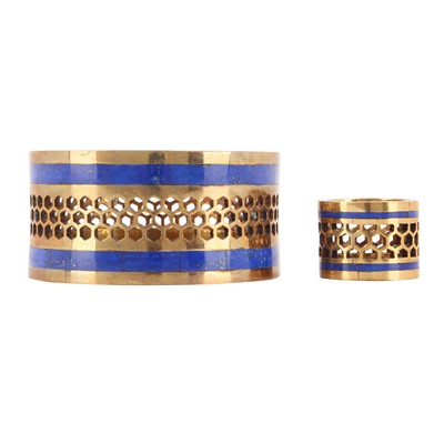 Lot 222 - A lapis lazuli and brass ring and a child bangle suite
