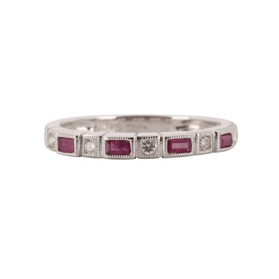 Lot 313 - A ruby and diamond half eternity ring