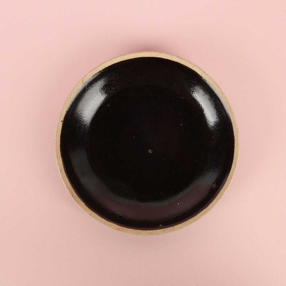 Lot 19 - A Chinese Henan black-glazed washer, Song dynasty