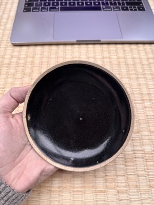 Lot 19 - A Chinese Henan black-glazed washer, Song dynasty