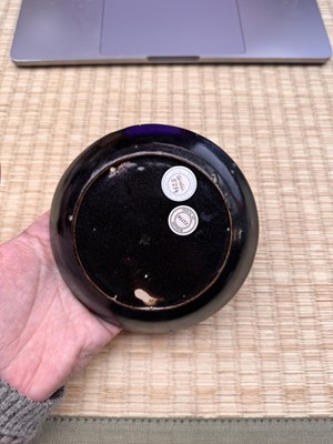 Lot 19 - A Chinese Henan black-glazed washer, Song dynasty