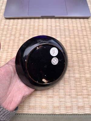 Lot 19 - A Chinese Henan black-glazed washer, Song dynasty