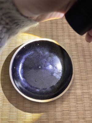 Lot 19 - A Chinese Henan black-glazed washer, Song dynasty