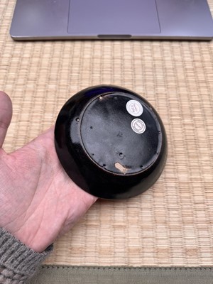 Lot 19 - A Chinese Henan black-glazed washer, Song dynasty