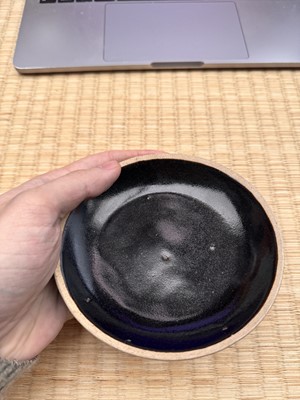 Lot 19 - A Chinese Henan black-glazed washer, Song dynasty