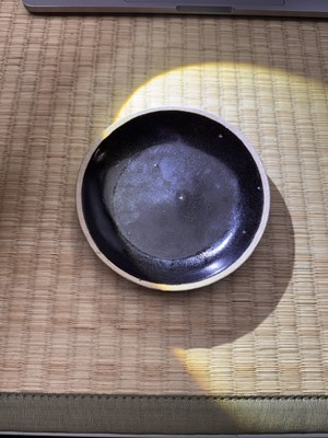 Lot 19 - A Chinese Henan black-glazed washer, Song dynasty