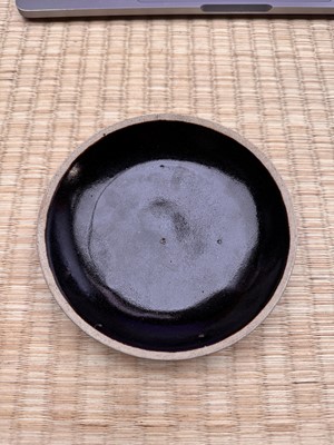 Lot 19 - A Chinese Henan black-glazed washer, Song dynasty