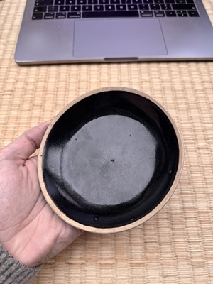 Lot 19 - A Chinese Henan black-glazed washer, Song dynasty