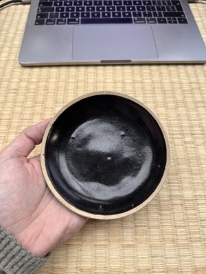 Lot 19 - A Chinese Henan black-glazed washer, Song dynasty