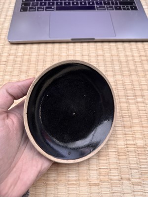 Lot 19 - A Chinese Henan black-glazed washer, Song dynasty