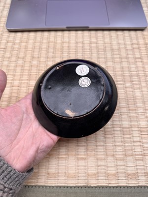 Lot 19 - A Chinese Henan black-glazed washer, Song dynasty