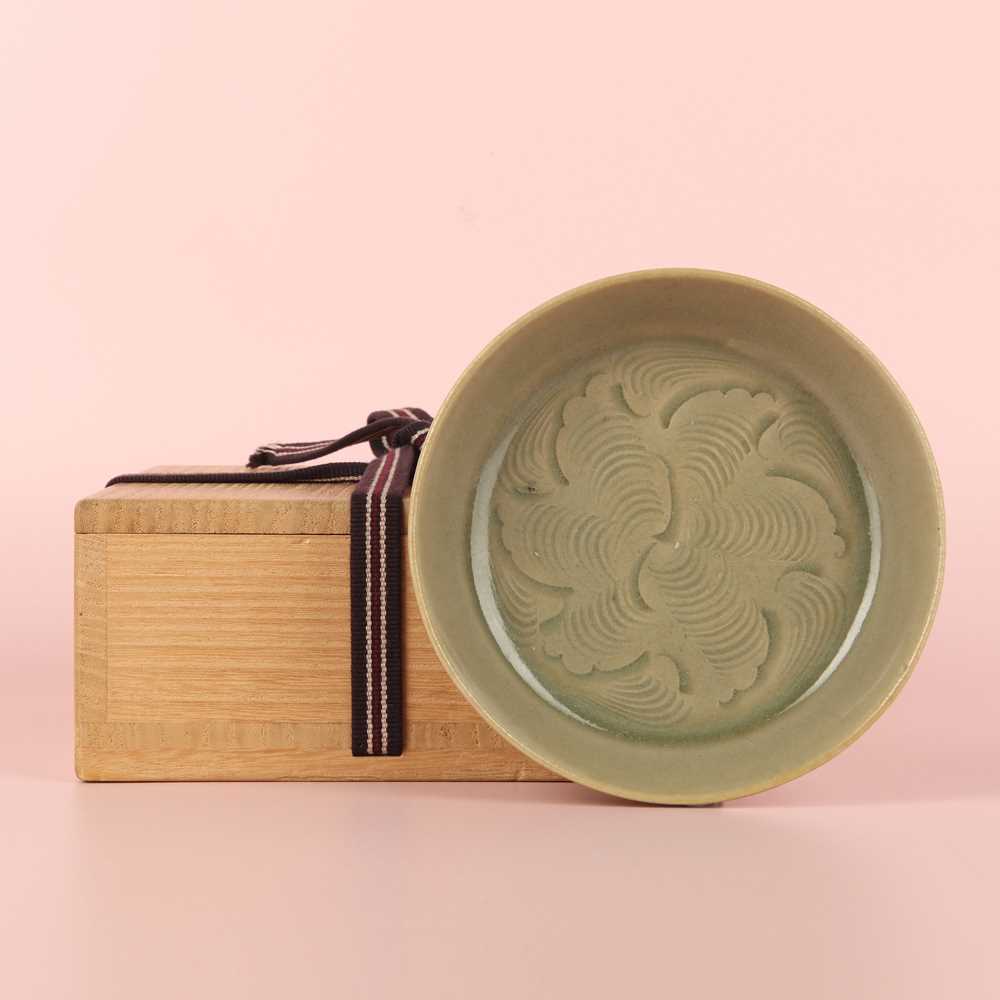 Lot 37 - A fine Chinese Yaozhou celadon 'waves' carved dish, Northern Song dynasty