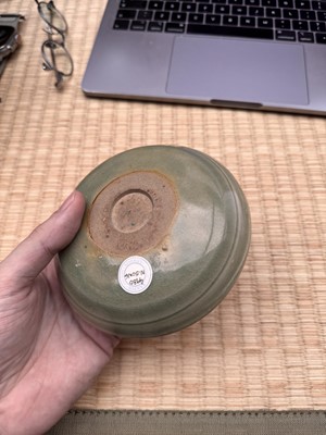 Lot 37 - A fine Chinese Yaozhou celadon 'waves' carved dish, Northern Song dynasty