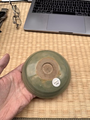 Lot 37 - A fine Chinese Yaozhou celadon 'waves' carved dish, Northern Song dynasty