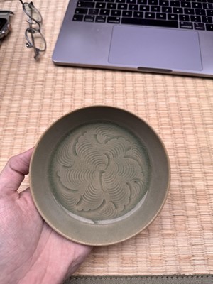 Lot 37 - A fine Chinese Yaozhou celadon 'waves' carved dish, Northern Song dynasty