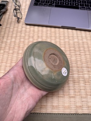 Lot 37 - A fine Chinese Yaozhou celadon 'waves' carved dish, Northern Song dynasty