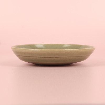 Lot 37 - A fine Chinese Yaozhou celadon 'waves' carved dish, Northern Song dynasty