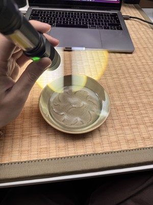 Lot 37 - A fine Chinese Yaozhou celadon 'waves' carved dish, Northern Song dynasty