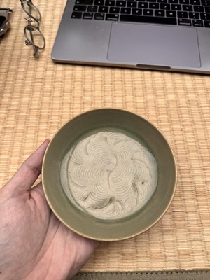 Lot 37 - A fine Chinese Yaozhou celadon 'waves' carved dish, Northern Song dynasty