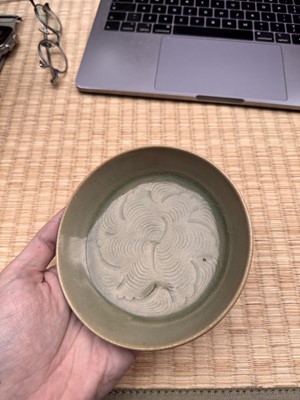 Lot 37 - A fine Chinese Yaozhou celadon 'waves' carved dish, Northern Song dynasty