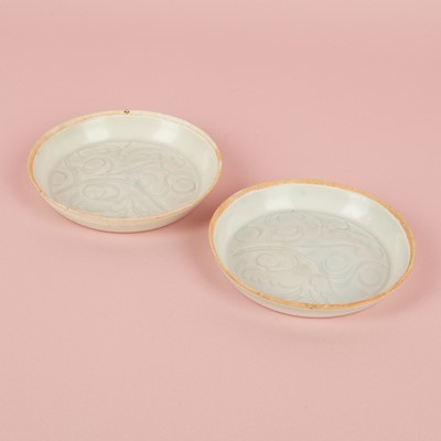 Lot 470 - A fine pair of small Chinese Qingbai 'floral' carved dishes, Southern Song dynasty