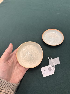 Lot 470 - A fine pair of small Chinese Qingbai 'floral' carved dishes, Southern Song dynasty