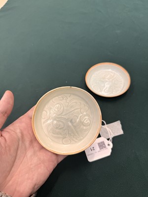 Lot 470 - A fine pair of small Chinese Qingbai 'floral' carved dishes, Southern Song dynasty