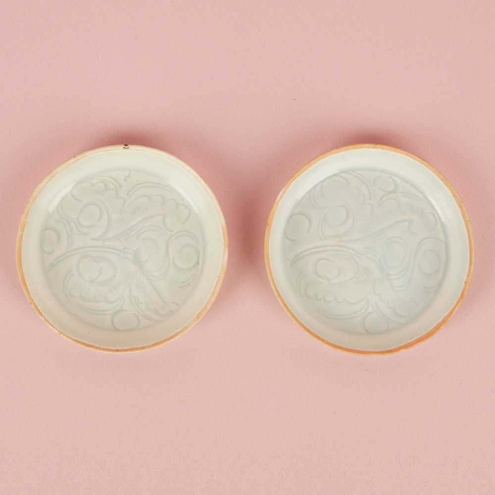 Lot 470 - A fine pair of small Chinese Qingbai 'floral' carved dishes, Southern Song dynasty