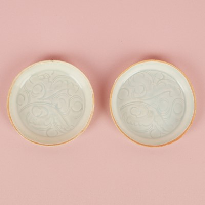 Lot 21 - A fine pair of small Chinese Qingbai 'floral' carved dishes, Southern Song dynasty