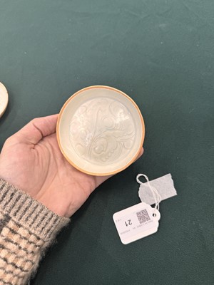 Lot 470 - A fine pair of small Chinese Qingbai 'floral' carved dishes, Southern Song dynasty