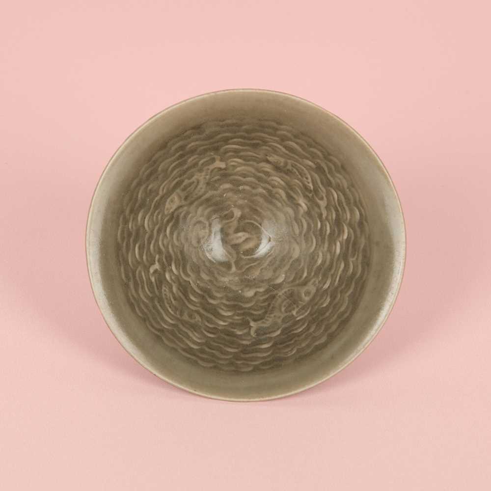 Lot 40 - A small Chinese Yaozhou celadon 'fish' moulded bowl, Northern Song dynasty