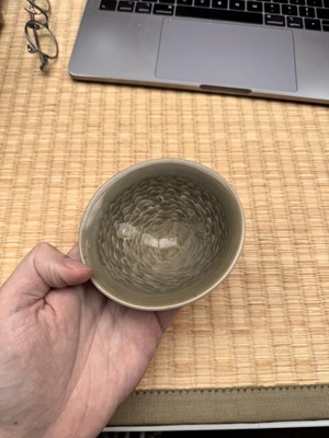 Lot 40 - A small Chinese Yaozhou celadon 'fish' moulded bowl, Northern Song dynasty