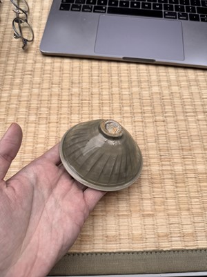 Lot 40 - A small Chinese Yaozhou celadon 'fish' moulded bowl, Northern Song dynasty