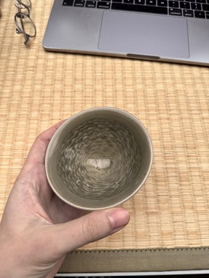 Lot 40 - A small Chinese Yaozhou celadon 'fish' moulded bowl, Northern Song dynasty