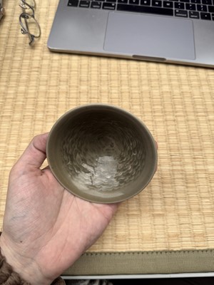 Lot 40 - A small Chinese Yaozhou celadon 'fish' moulded bowl, Northern Song dynasty