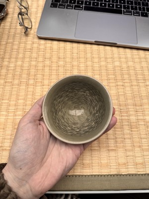 Lot 40 - A small Chinese Yaozhou celadon 'fish' moulded bowl, Northern Song dynasty