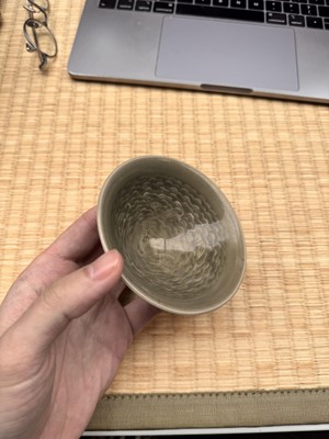 Lot 40 - A small Chinese Yaozhou celadon 'fish' moulded bowl, Northern Song dynasty