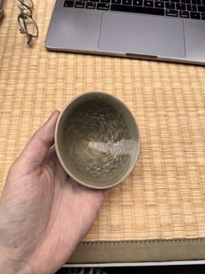 Lot 40 - A small Chinese Yaozhou celadon 'fish' moulded bowl, Northern Song dynasty