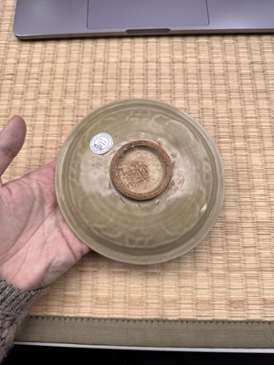 Lot 42 - A rare Chinese Yaozhou celadon 'butterfly' moulded dish, Song dynasty