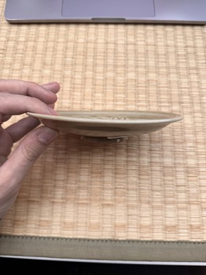 Lot 42 - A rare Chinese Yaozhou celadon 'butterfly' moulded dish, Song dynasty