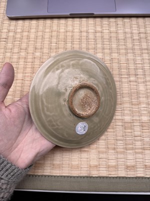 Lot 42 - A rare Chinese Yaozhou celadon 'butterfly' moulded dish, Song dynasty