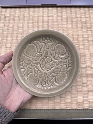 Lot 42 - A rare Chinese Yaozhou celadon 'butterfly' moulded dish, Song dynasty