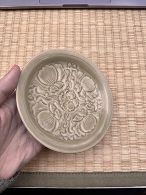 Lot 42 - A rare Chinese Yaozhou celadon 'butterfly' moulded dish, Song dynasty