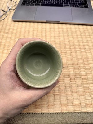 Lot 1 - A Chinese Longquan celadon 'floral' carved stem cup, Yuan - Early Ming dynasty