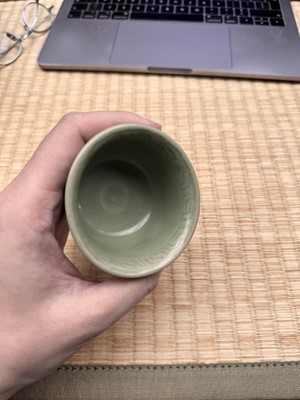 Lot 1 - A Chinese Longquan celadon 'floral' carved stem cup, Yuan - Early Ming dynasty