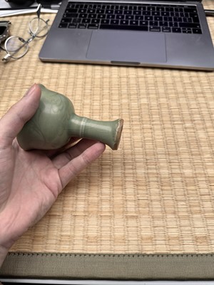 Lot 1 - A Chinese Longquan celadon 'floral' carved stem cup, Yuan - Early Ming dynasty