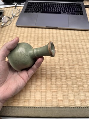 Lot 1 - A Chinese Longquan celadon 'floral' carved stem cup, Yuan - Early Ming dynasty