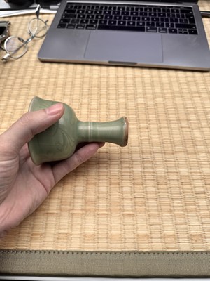 Lot 1 - A Chinese Longquan celadon 'floral' carved stem cup, Yuan - Early Ming dynasty