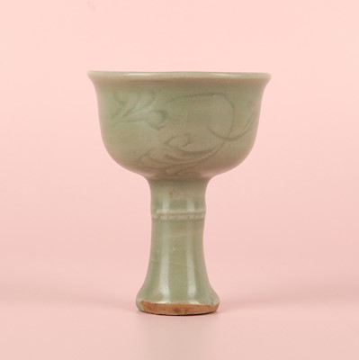 Lot 1 - A Chinese Longquan celadon 'floral' carved stem cup, Yuan - Early Ming dynasty